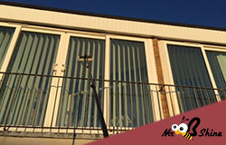 cleaning a window through ballustrades in bedford bedfordshire